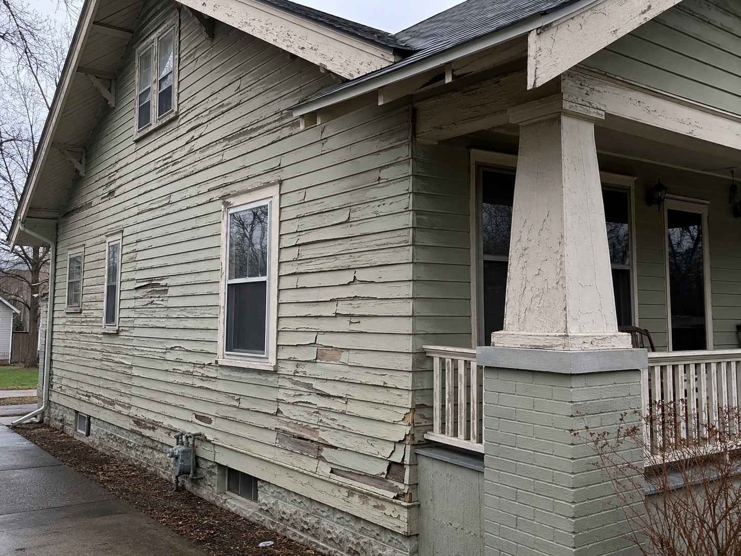Vinyl siding transformation before project | Home Improvement Contractor in Central Michigan